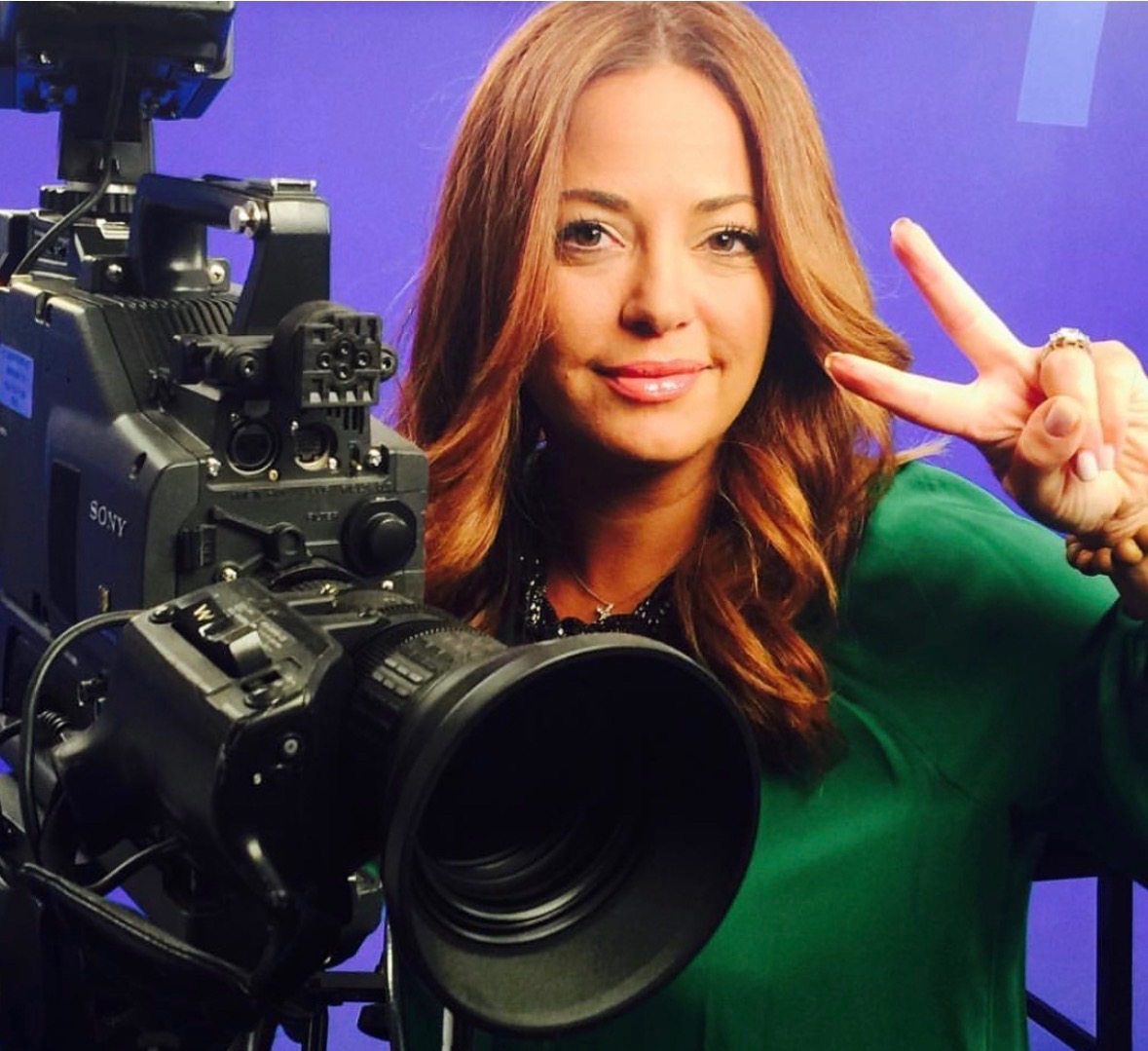 Dr. Nelly Zahiri on the MomTalk L.A. television set beside a studio camera